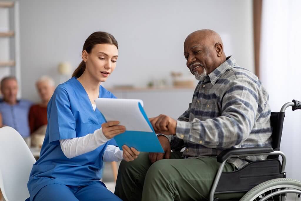 A nurse going over health information with a patient.