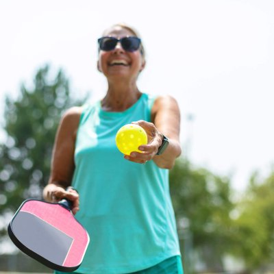 Mature Adult Female Playing Pickle Ball Photo Series