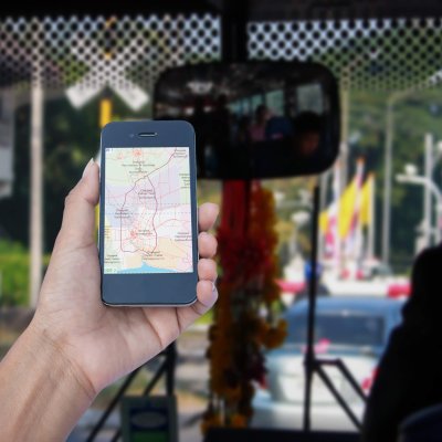 hand hold map on smart phone in bus