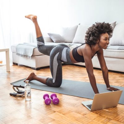 Young beautiful woman exercising at home, fitness concept