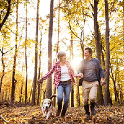 older-couple-dog-walk